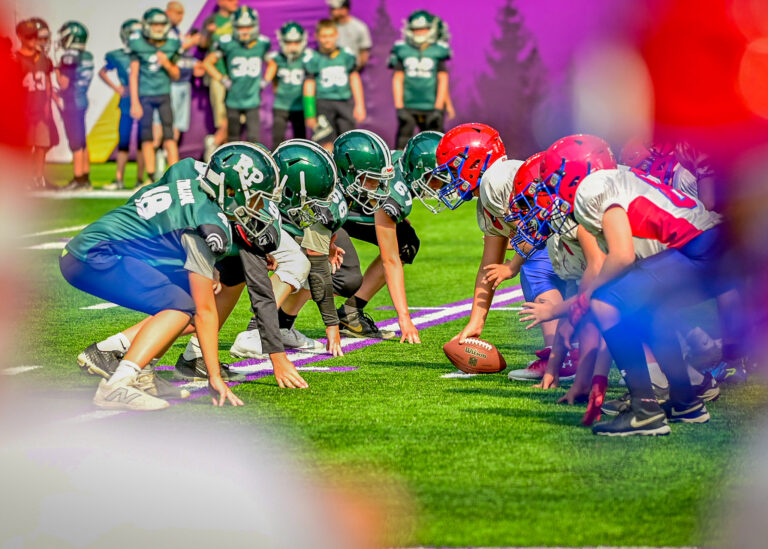 Football linemen squaring off at the line