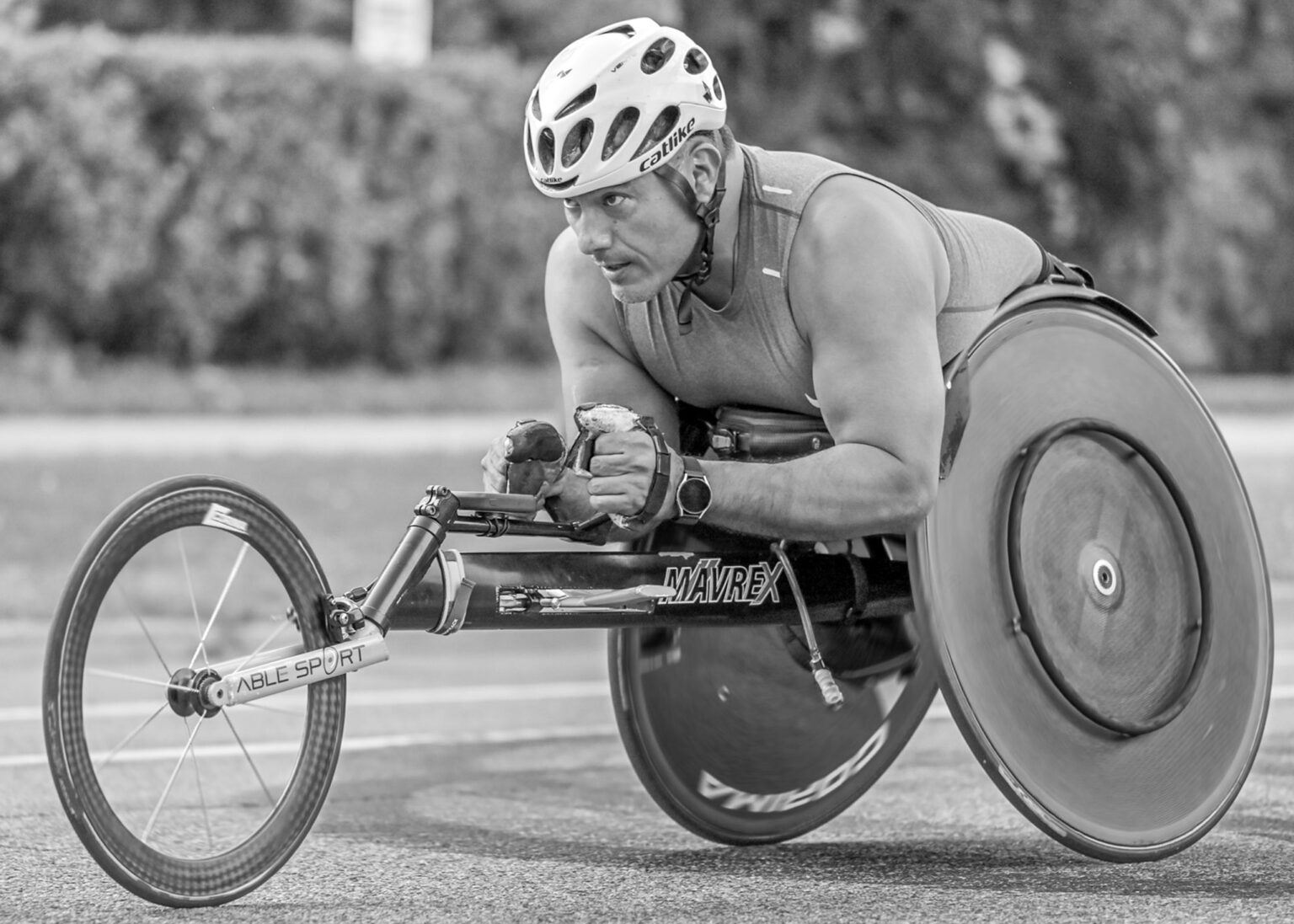 Wheelchair racing athlete in black and white
