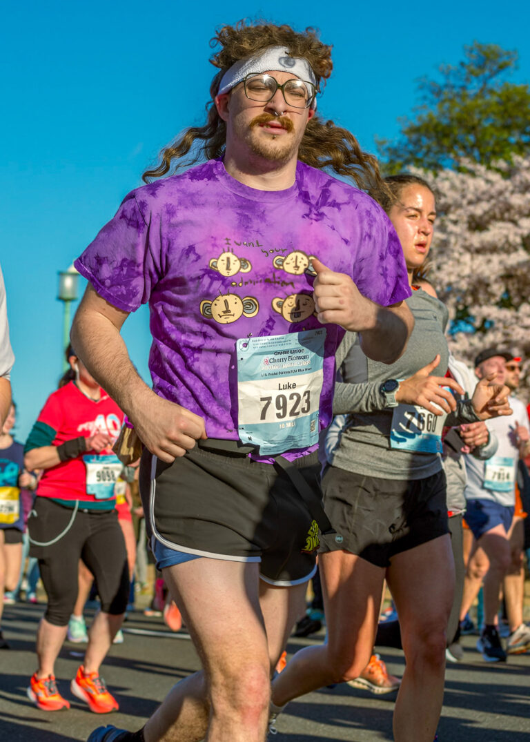 Marathon runner wearing a race bib, running photography Minneapolis