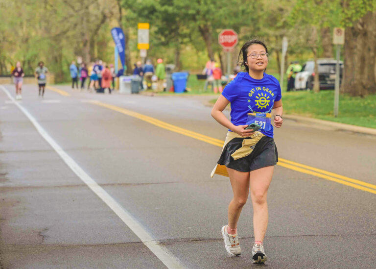 Runner on a closed road during a race, running photography Minneapolis