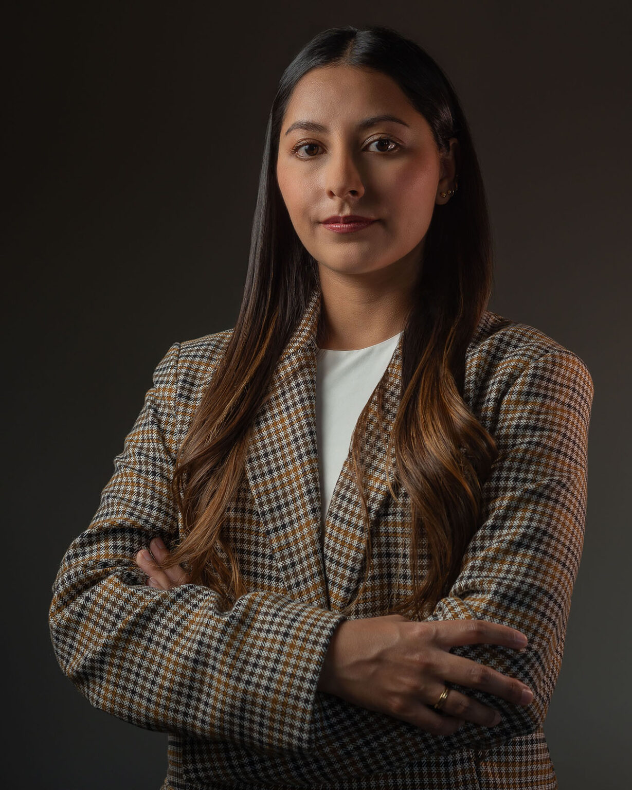 Studio portrait of a woman in a tweed blazer